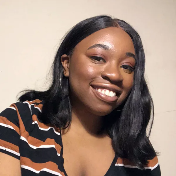 Sosa, founder of Joyware Studio, smiling.